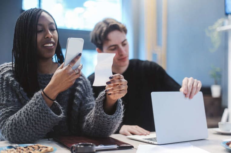 people scanning receipts with phone