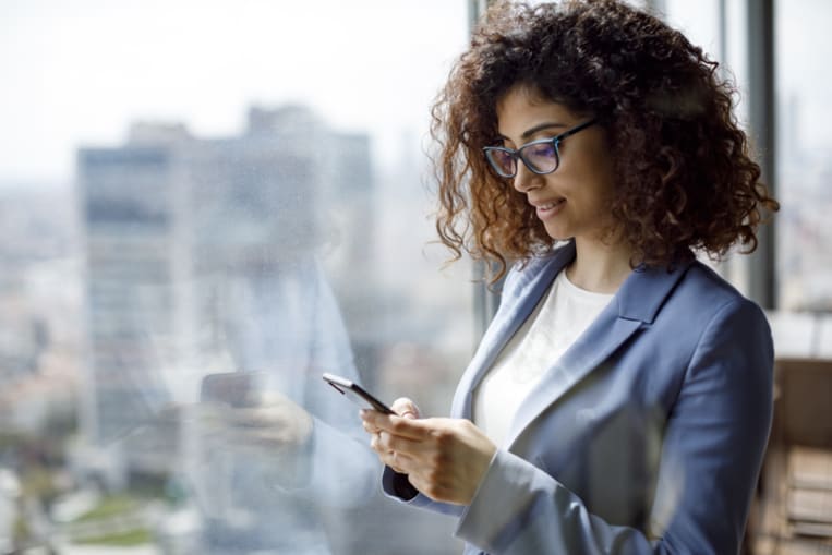 woman reading text on phone