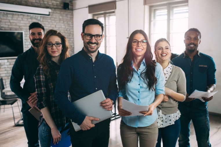 happy group of employees in office