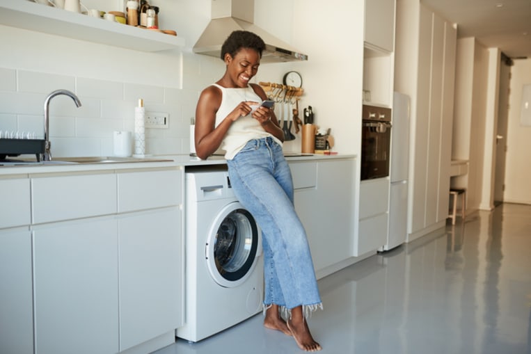 woman standing in laundry room