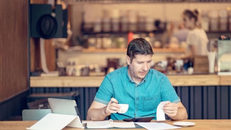 Accountant looking worried over the profit and loss accountancy papers