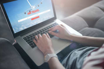 person booking airfare online