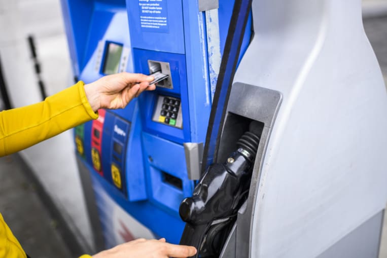 person pumping gas