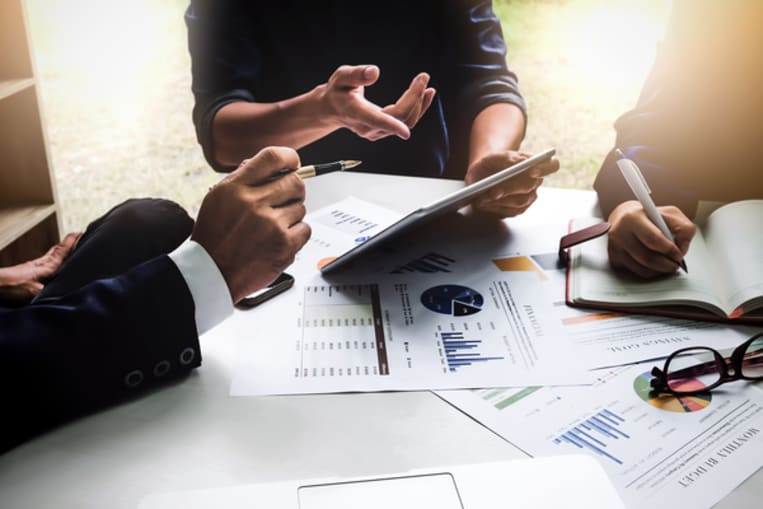 business people working with spreadsheets
