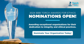 Torch Award against a blue sky with information about nominating an organization.