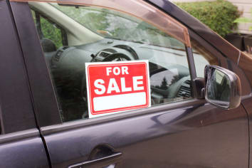 For sale sign on used car