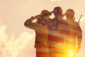 Silhouettes of soldiers with print of sunset and USA flag saluting on a background of light sky. Greeting card for Veterans Day, Memorial Day, Independence Day. America celebration. 3D-rendering.