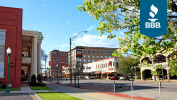 Vibrant image of downtown Fort Smith, Arkansas showing buildings and blooming trees