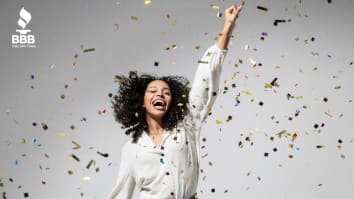 woman happy celebrating in confetti