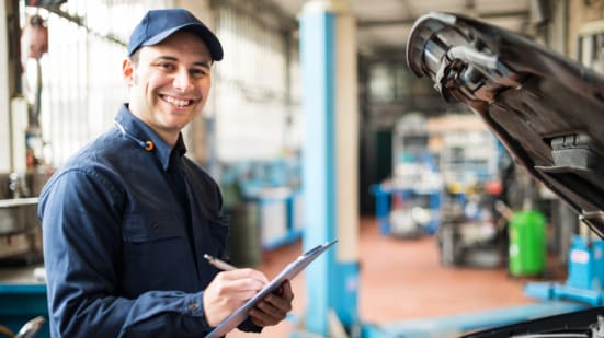 Portrait of a mechanic at work in his garage