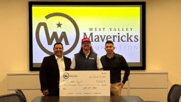 Photo of two BBB Serving the Pacific Southwest representatives accepting grant from West Valley Mavericks