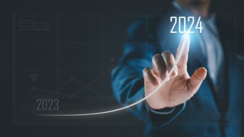 Graphic line showing transition from 2023 to 2024 with business person pointing to 2024