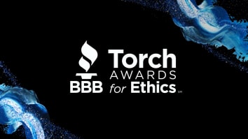 The BBB Torch Awards for Ethics logo in white stands against a black background with embellishments in the corners of various shades of blue.