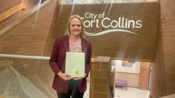 BBB Serving Northern Colorado president and CEO Shelley Polansky holding a copy of the Thank a Business Month proclamation in the Fort Collins city building.