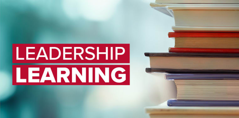 Book stack in the library room and blurred bookshelf, business and education background