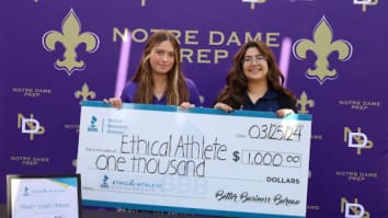 Photo of high school student being presented with $1,000 scholarship by BBB Representative