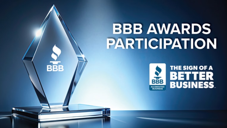 A triangle prism shaped award with the BBB logo on it and the words BBB Awards Participation