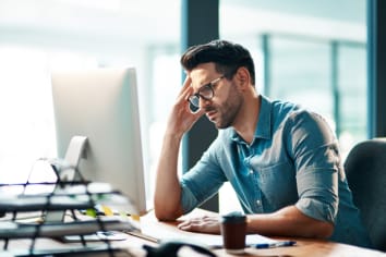 Stressed business man at computer