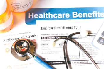 Open enrollment healthcare benefit forms.