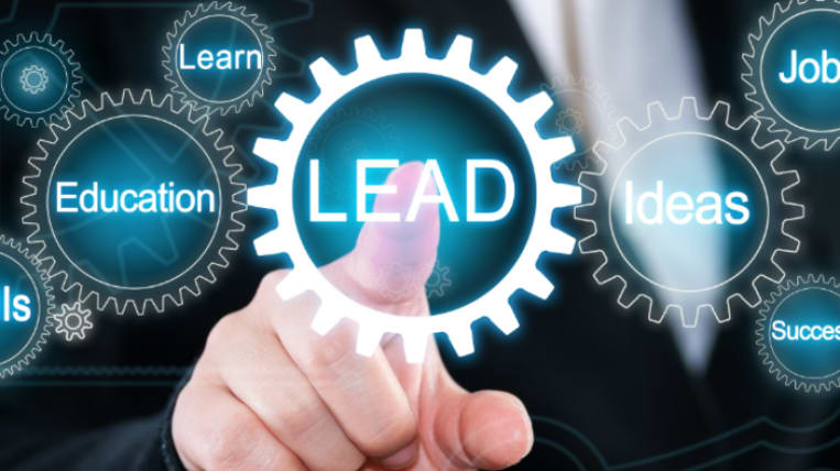 Finger Pointing at a screen that says lead
