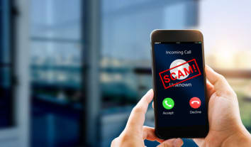 Phone Scam, fraud or phishing concept.Unknown caller show on mobile phone screen.