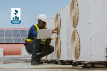 Black male looking at heating and air conditioning units.