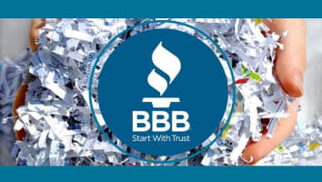  Image of hands holding shredded paper with the BBB logo in the center