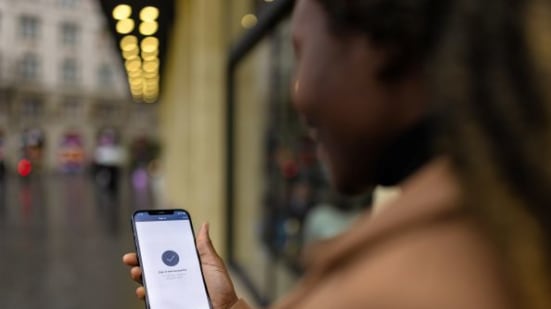 Woman shown logging in on phone