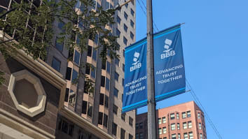 A blue street banner with the BBB logo and the words "Advancing Trust Together," posted outside of BBB St. Louis' office building in downtown St. Louis.