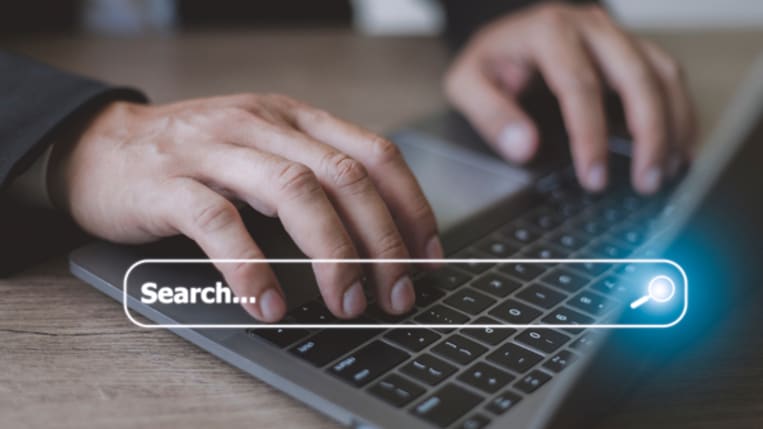 People hand using laptop or computer searching for information in internet online society web with search box icon and copyspace.