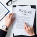 person looking at insurance document