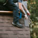 man working on roof