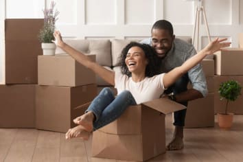 happy african american couple moving into new home