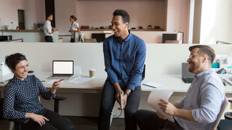 diverse group of colleagues sitting in office