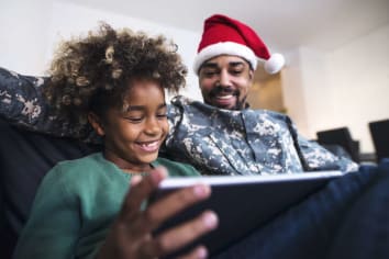 african american father smiling with child