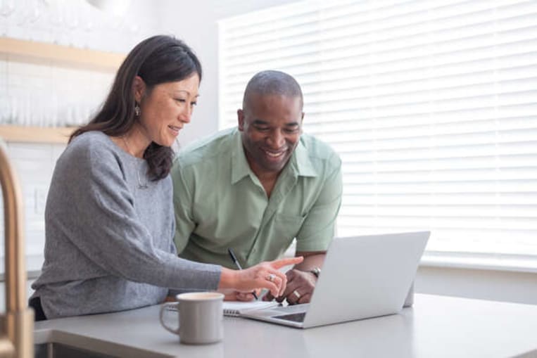 couple looking at laptop together