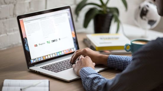 person working at computer desk