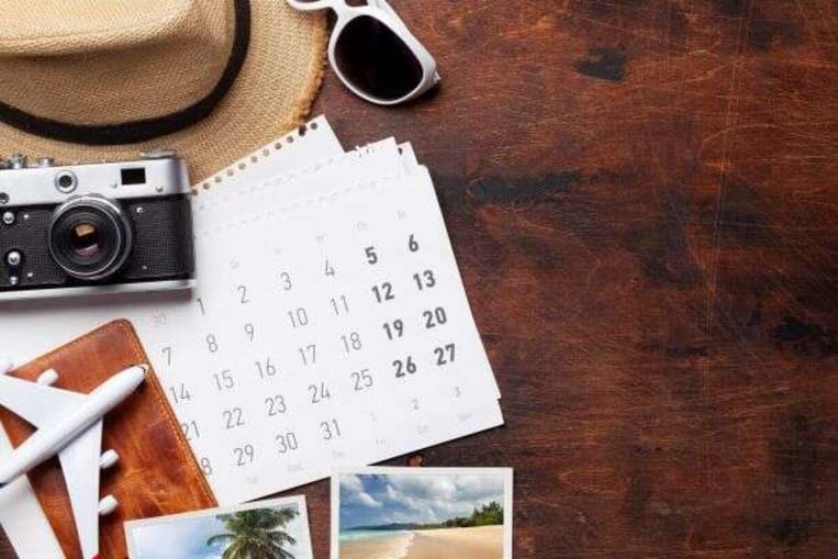 camera, calendar, desk, phone, travel plans 