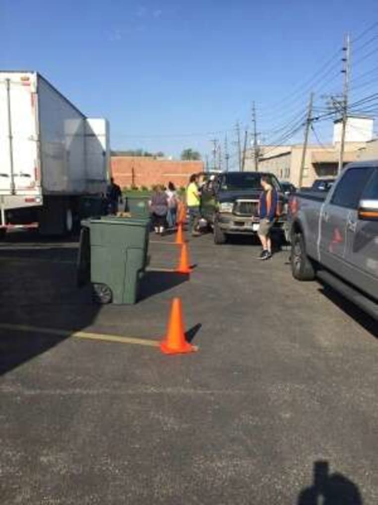 cars lined up to drop off documents to be shred