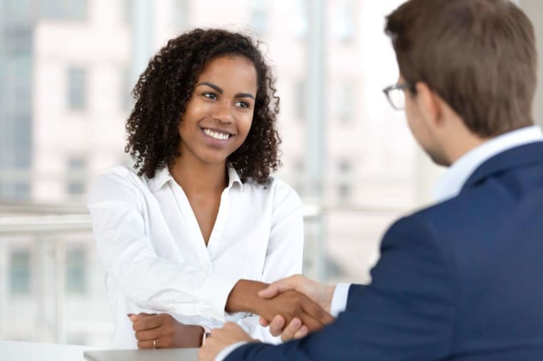 white male job recruiter interviewing african american woman